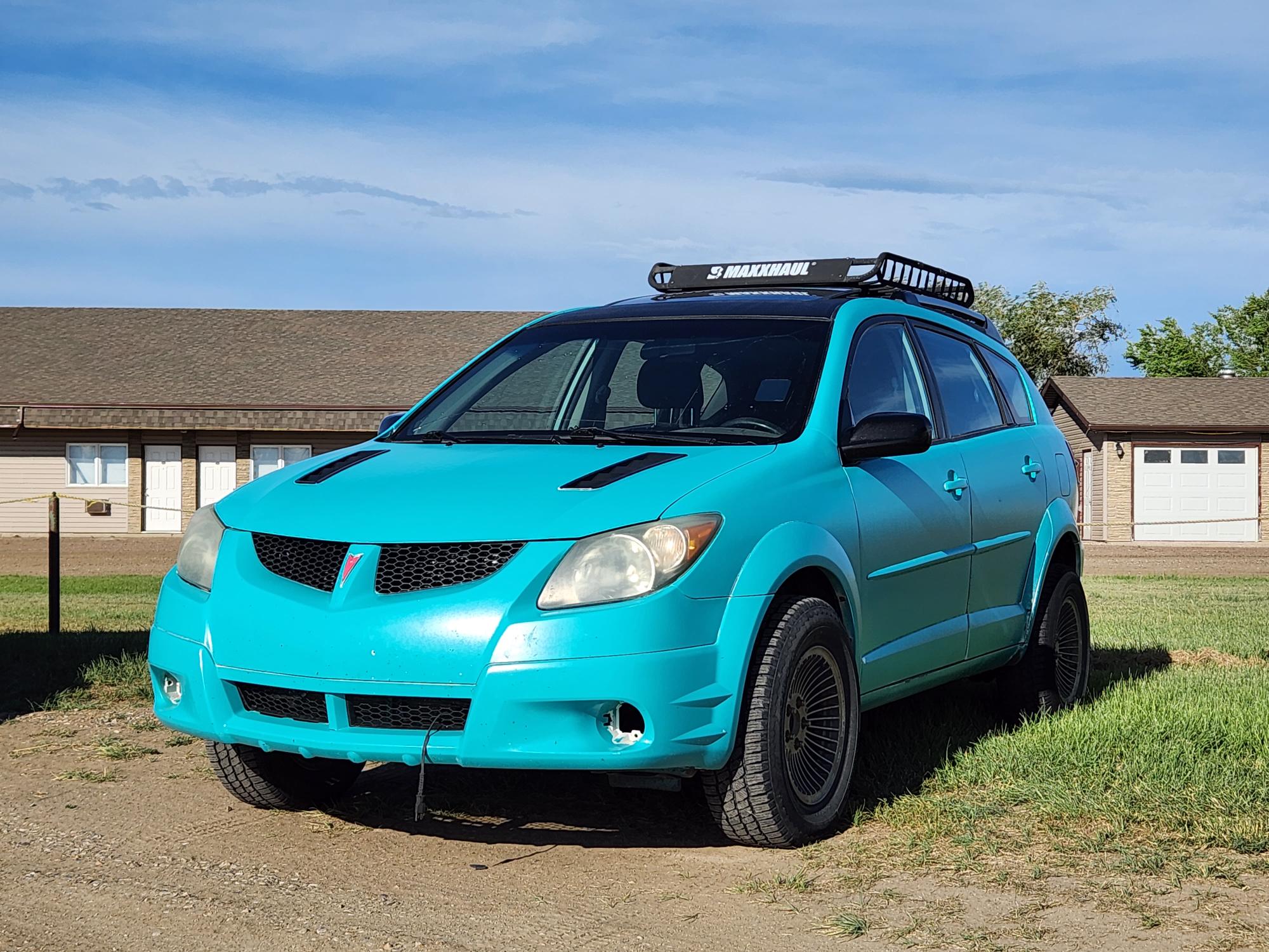 Chrome, cream, and a valve cover racing scene in Shaunavon
